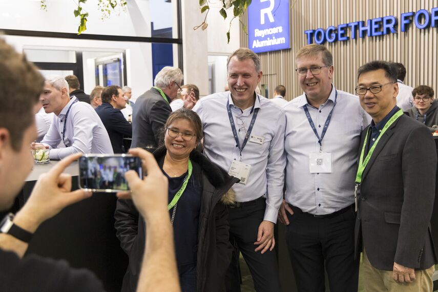 Bert Geerinckx and Jurgen Cop taking a picture with customers.