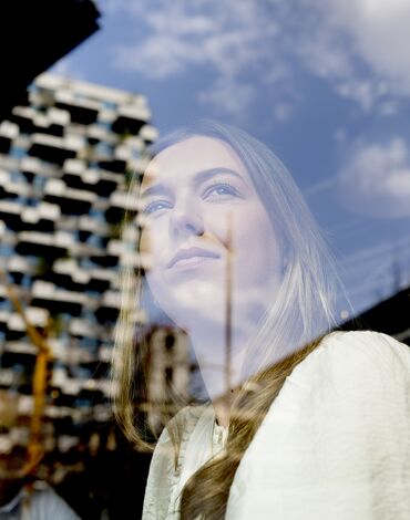 girl looking out of a window