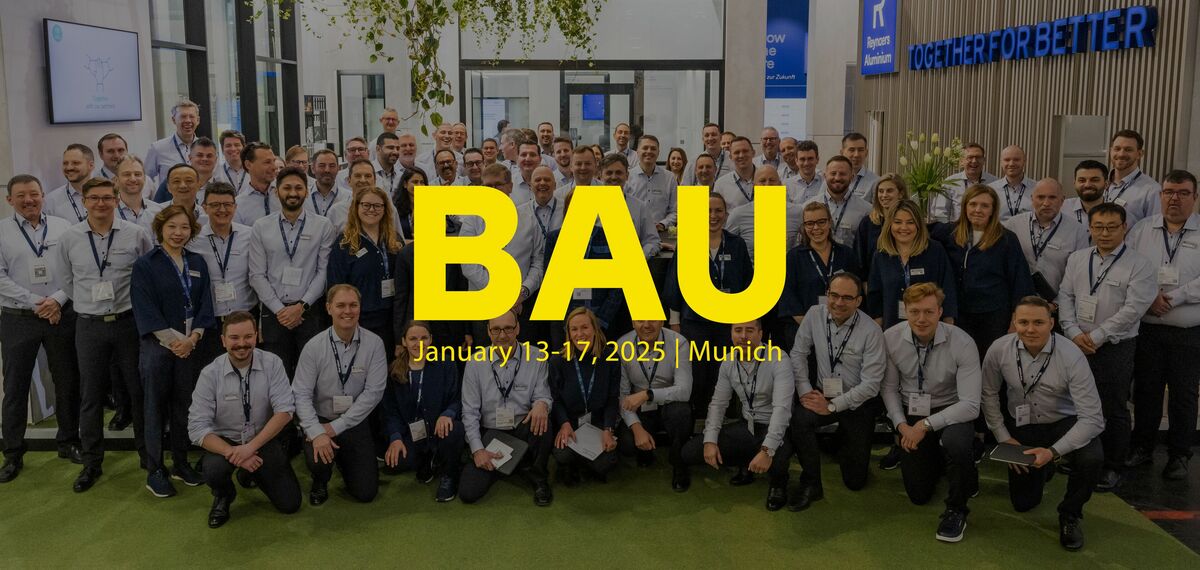 BAU logo in front of Reynaers stand crew.