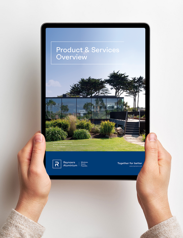 ipad with brochure held by two hands