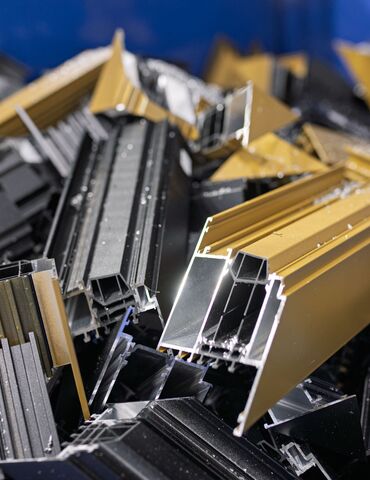 aluminium profile scrap in blue container